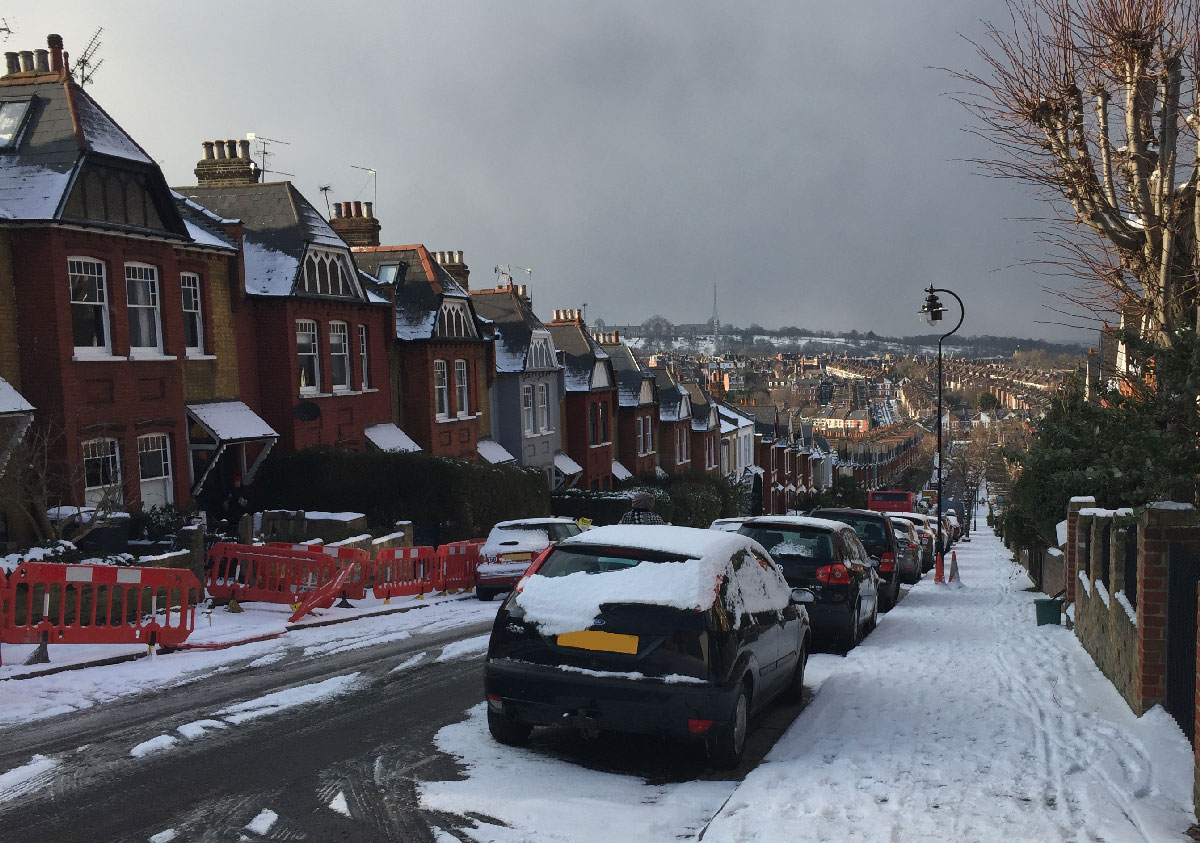 A snow-covered vista from Stroud Green over Crouch End towards Alexandra Palace